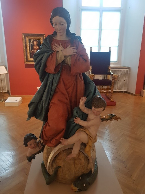 A statue of the Virgin Mary on the globe